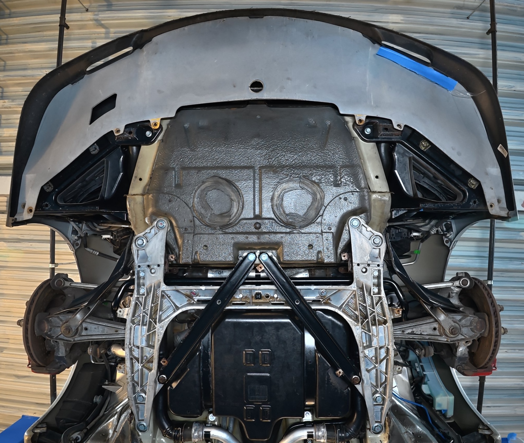 Porsche 911 underbody after dry ice cleaning and IGL Aegis — clean, treated surface